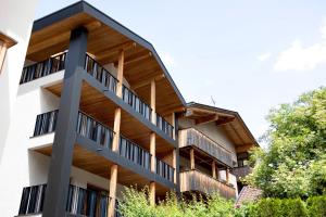 an external view of a building with wooden balconies at Kriendl Nr 1 in Valdaora