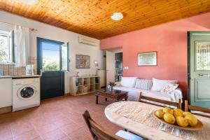 a living room with a couch and a table at Ktima Dilberaki in Lixouri