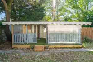 a gazebo in the backyard of a house at Mh310 La Tremblade in La Tremblade