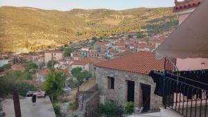 a view of a town from the balcony of a house at Nicol apartment in Koustáros