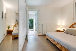 a bedroom with two beds and a hallway at Villa Savi Lake View and Pool in Torri del Benaco +30 photos