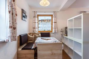 a small room with a table and a window at Bergwelt C in Niederau