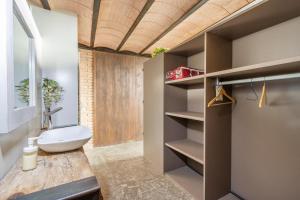 a bathroom with a sink and a toilet in a room at El Cobert De Lera in Oden