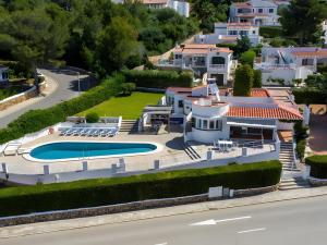 an aerial view of a house with a swimming pool at V206 Villa Isabel in Son Bou