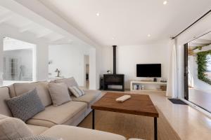 a living room with a couch and a table at V206 Villa Isabel in Son Bou