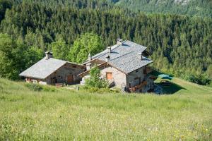a large house on the side of a hill at Civico 2 in Marmora
