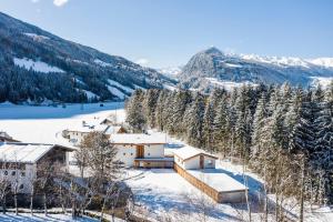 a resort in the mountains with snow on the ground at Lichtung Woldererhof Sonnenlicht in Racines +9 photos