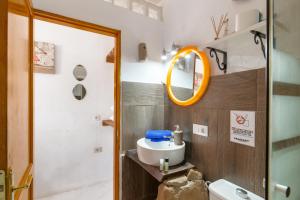 a bathroom with a sink and a mirror at Loft La Caletilla La Graciosa in Caleta de Sebo +11 photos