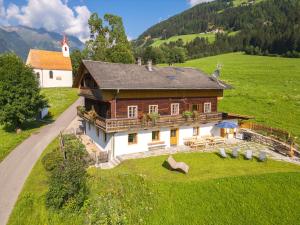 an aerial view of a house in a green field at Ferienhaus Oberschneider in Selva dei Molini