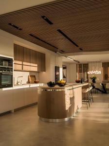 a kitchen with a island in the middle of a room at Villa 11 Sunset in Marbella