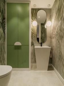 a bathroom with a sink and a mirror at Villa 11 Sunset in Marbella +21 photos