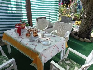 a table with a plate of food on it at Il SORRISO in Moie +8 photos