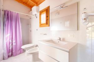 a bathroom with a toilet and a sink at Agriturismo Alimini a Otranto in Alimini +127 photos