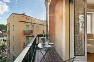a balcony with a table on top of a building at Apartment Beach next to 5 Terre in Bonassola