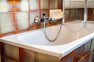 a sink in a bathroom with a shower at Ferienwohnung Gatscherhof in Luson