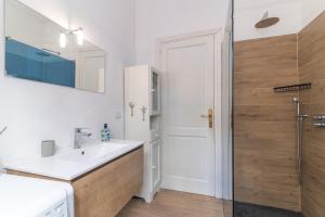 a bathroom with a sink and a shower at Villa Rosa sul mare in Olbia +20 photos