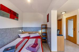 a bedroom with a bed and a ladder in it at An der Schwäbischen Alb in Mössingen