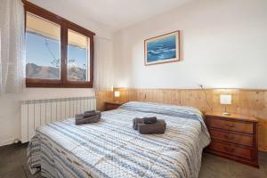 a bedroom with a bed with two chairs on it at Magic moment in Lake Como in Perledo