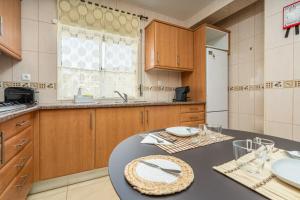 a kitchen with a table with a plate on it at Casa Quintião in Ferragudo +17 photos