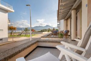 a balcony with chairs and a table on a building at Cas Cover in Santa Margalida