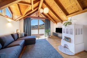 a living room with a couch and a fireplace at Apartment Luisa in Silandro