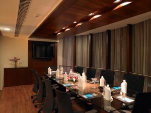 a conference room with a long table and chairs at Blu Petal - A Business Hotel in Bangalore