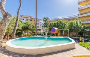 a small pool in a courtyard with a playground at Tosca Mar 223 in Moraira