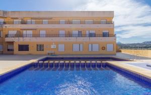a building with a swimming pool in front of a building at Tosca Mar 223 in Moraira