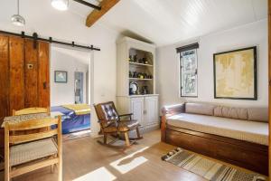 a bedroom with a bed and a chair in a room at Casa do Campo Dornes Três in Paio Mendes +24 photos