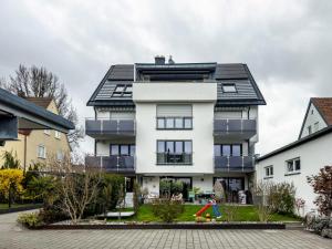 a house with a playground in front of it at Fink - Vogelhaus in Friedrichshafen