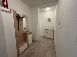 a white room with a mirror and a wooden floor at Haci Babas Home in Bestwig +15 photos