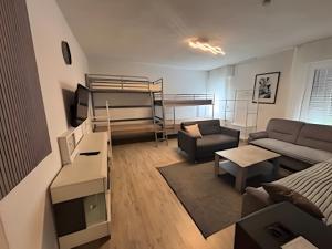a living room with a couch and a bunk bed at Haci Babas Home in Bestwig