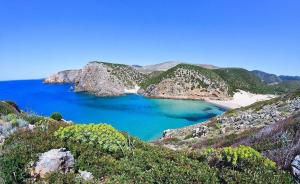 a large body of water in the middle of a mountain at Casa Ornella in Nebida
