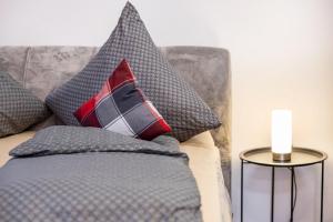 a bed with two pillows on top of it at Ferienwohnung Fernblick in Pottenstein
