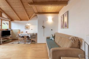 a living room with a couch and a table at Ferienwohnung Thymian Thalerhof in Ponte Nova