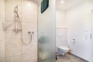 a bathroom with a shower and a toilet at Fichte in Ravensburg +15 photos