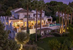 an aerial view of a large white house with trees at Villa Sildavia in Estepona