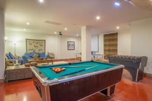 a living room with a pool table in it at Villa Sildavia in Estepona