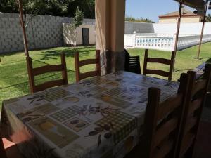 a table with a table cloth on it in a yard at Chalet Tu Limonero in Chiclana de la Frontera +15 photos