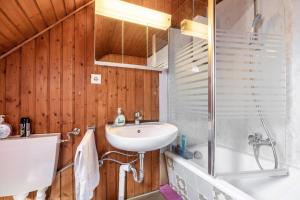 a bathroom with a sink and a shower at Haus Elseaue in Bünde +13 photos