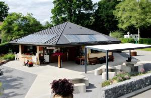 a building with a roof with solar panels on it at Chalet 35m2 3 chambres in Sciez