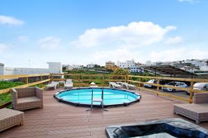 a swimming pool on the roof of a building at Montemar 1 in Moya