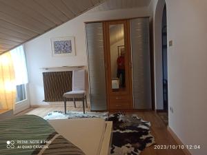 a man standing in a living room with a mess in a room at Apartement Jörg in Lana +7 photos