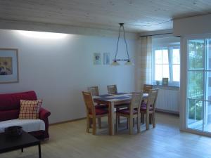 a dining room with a table and chairs at Ferienhof Roller in Simmersfeld