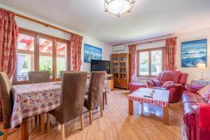 a living room with a table and a couch at Villa Juana Maria in Cala Murada