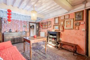 a living room with a table and a couch at Villa Gabriella - Piazzano in Lucca