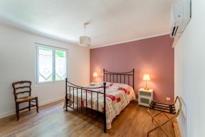 a bedroom with a bed and a window at Le Secret D'hestia in Bollène +22 photos