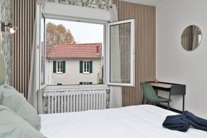 a bedroom with a bed and a window at Villa Milady 2 in Salies-du-Salat +77 photos