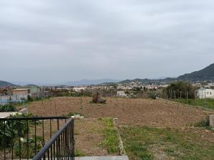 a view of a field with a city in the background at Thea Home Rhodes Pastida in Pastida