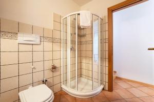 a bathroom with a shower and a toilet at Appartment Capri in Tignale +19 photos